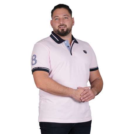 Polo en coton rose uni avec une coupe droite et un col à revers