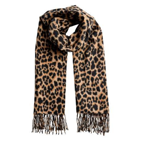 Écharpe beige à motifs animaliers noirs avec des franges tressées