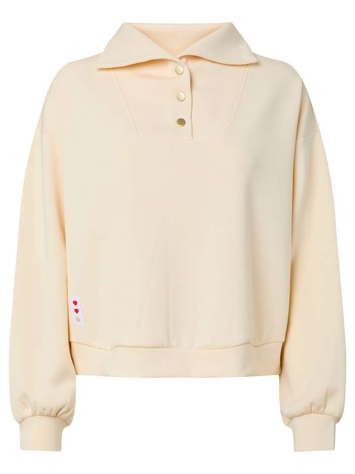 Sweat beige uni avec une...
