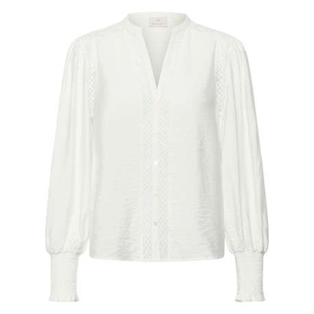 Chemisier blanc uni avec une coupe droite et des manches longues