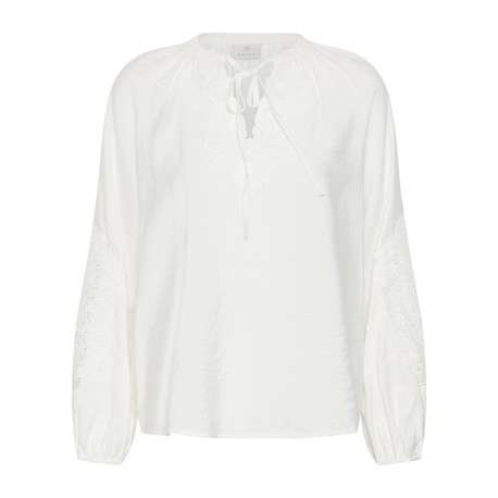 Blouse blanche unie avec une coupe droite et des manches longues