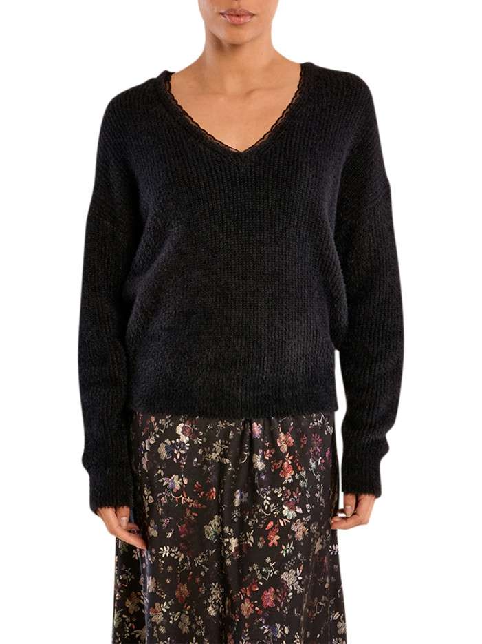 Pull noir uni avec une...