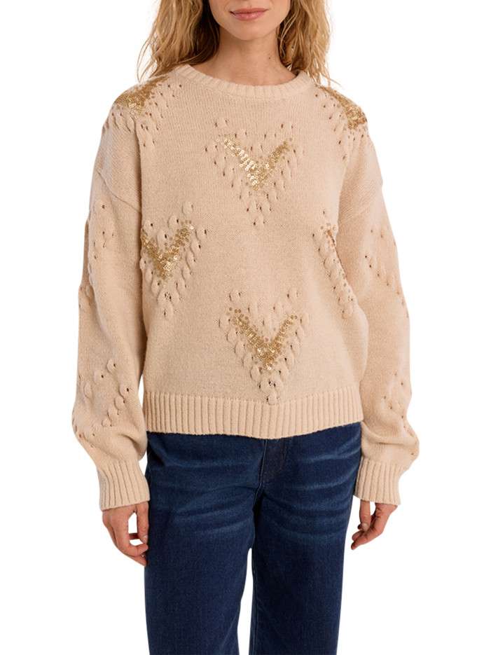 Pull beige à coupe droite...