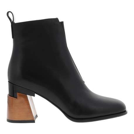 Boots en cuir noir à talon décroché haut dotées d'un zip et d'une languette
