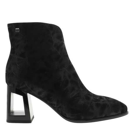 Boots en cuir noir à talon décroché haut munies d'un zip latéral