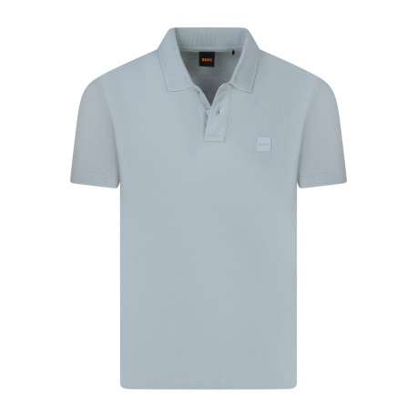 Polo en coton bleu clair avec une coupe droite pourvu d'un col boutonné