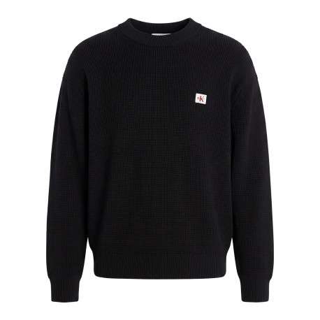Pull en coton noir à coupe droite pourvu d'un col rond et de manches longues