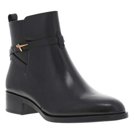 Boots en cuir noires à talon décroché bas avec un zip latéral doré
