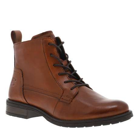 Bottines en cuir cognac avec semelle à talon décroché bas et fermeture zippée